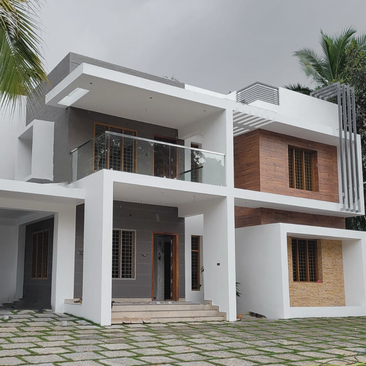 Grey and timber residence with glass balcony railing